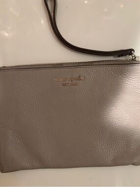 kate spade gray leather wristlet with gold logo